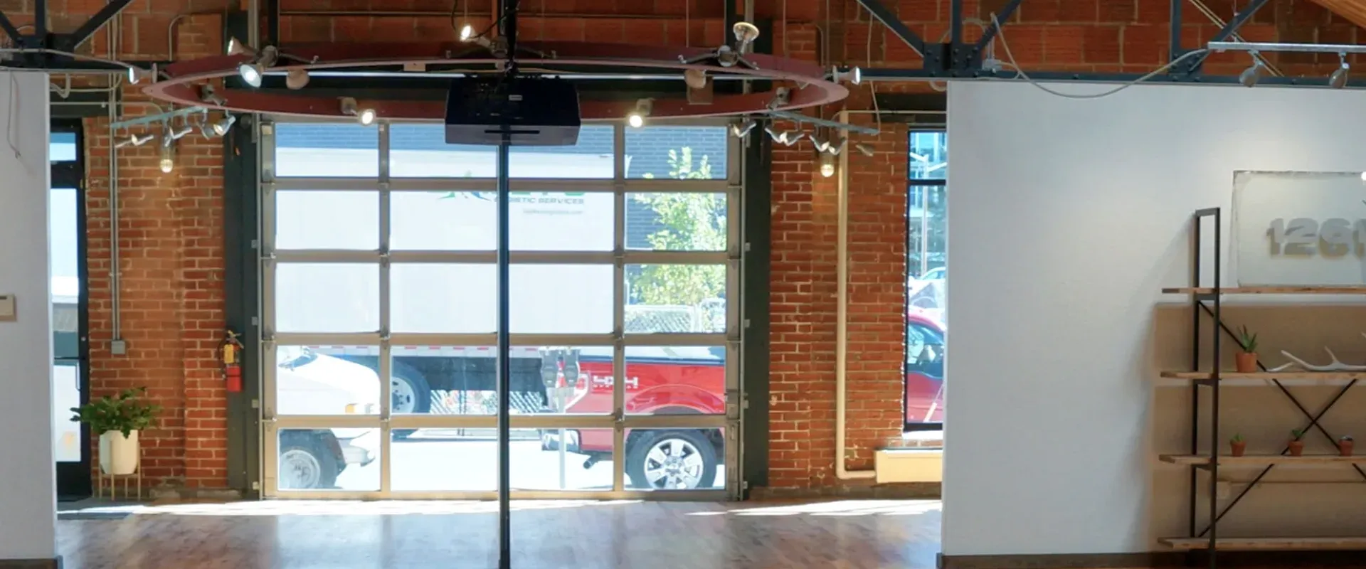 Restored steel-and-glass garage door at the Delaware Street entrance to Sterling Event Space.