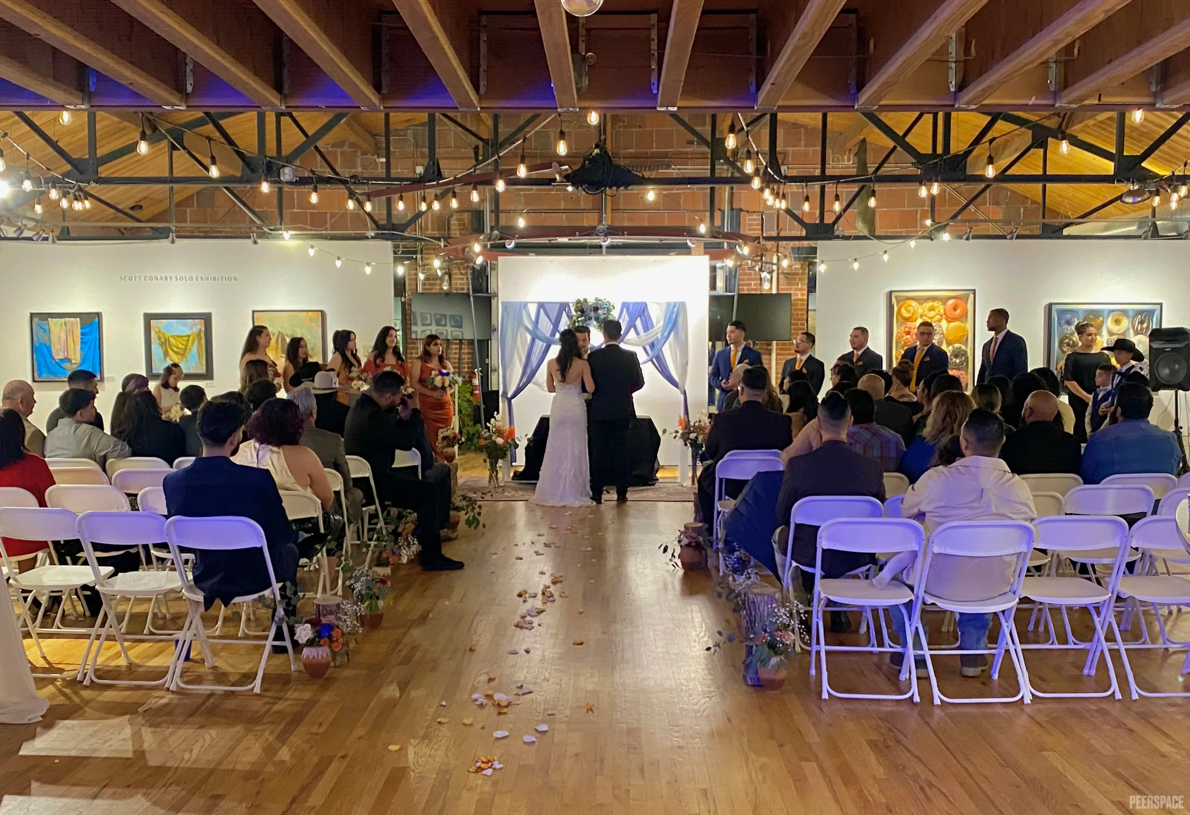 Sterling Event Space — wedding ceremony in the main hall. Denver Golden Triangle.