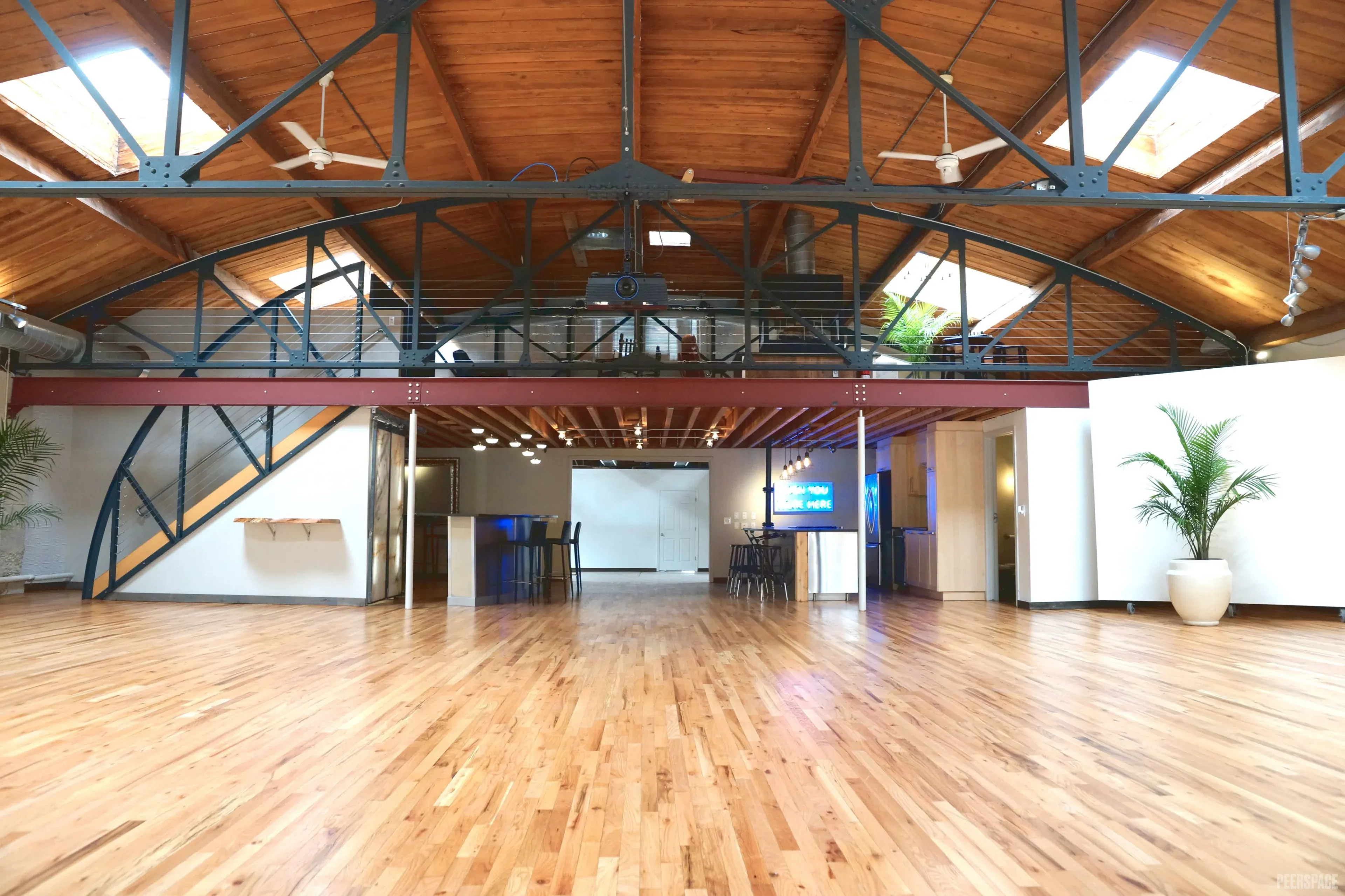 Sterling Event Space main floor with mezzanine and barrel-vaulted ceiling, looking northwest. Denver Golden Triangle event venue.
